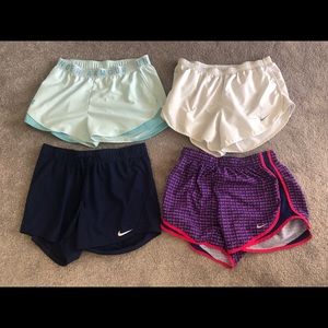 4 pairs of athletic shorts. 3 Nike 1 under armor